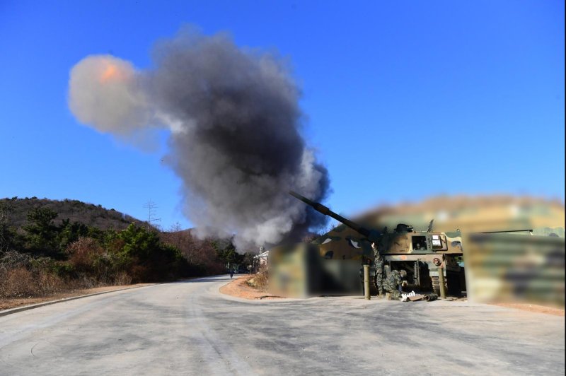 South Korea's Northwestern Island Defense Command is shown firing artillery shells from Baengyeong Island on Friday in response to North Korean shelling. Photo provided by the Republic of Korea Defense Department/X