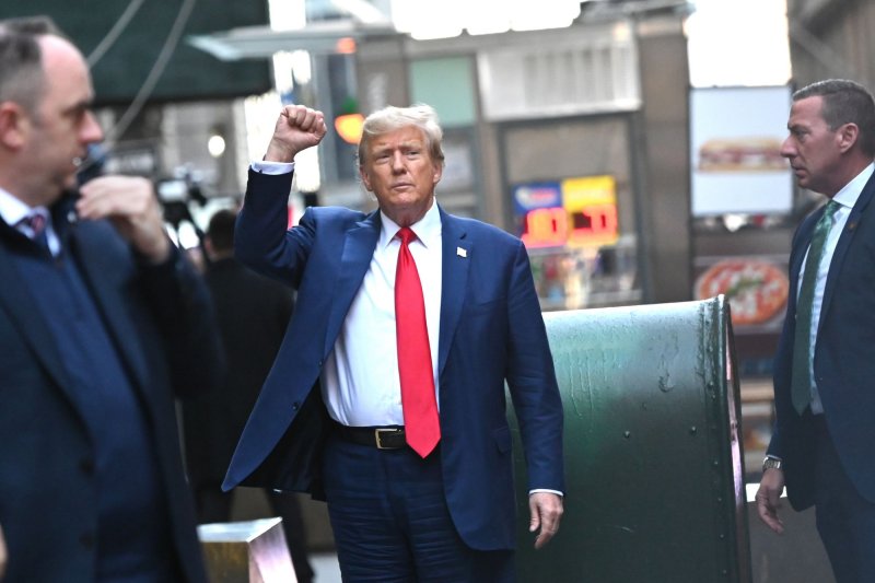 Former President Donald Trump gestures to supporters in Manhattan in January 2023. On Friday, the Oregon Supreme Court said it will keep Donald Trump on the 2024 primary ballot as it waits to see how the Supreme Court decides a case in Colorado. File Photo by Louis Lanzano/UPI