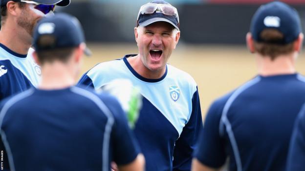 Grant Bradburn cracks a joke while in charge of Scotland in 2022