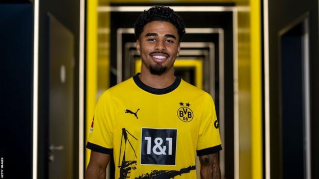 Ian Maatsen smiles in Dortmund kit