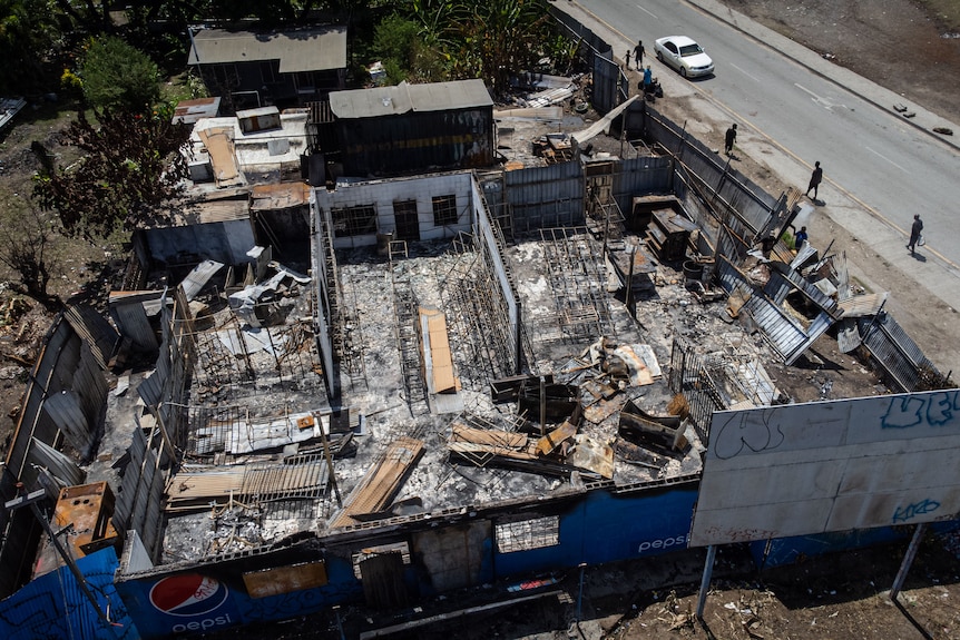 A drone shot of a burned out shop.