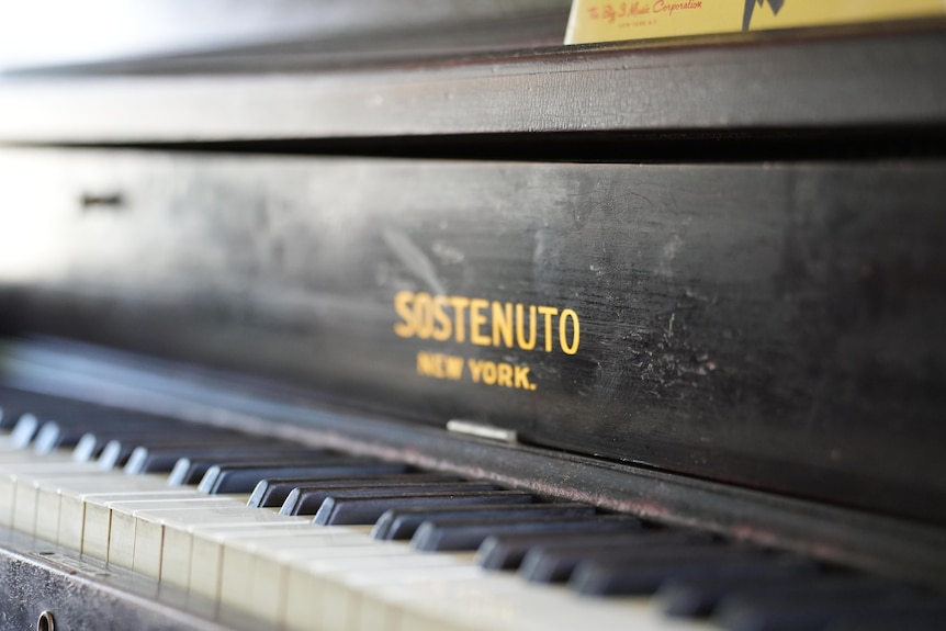 close up of a piano and its keys 