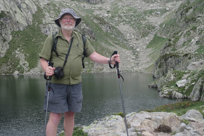 A man hiking in mountains.