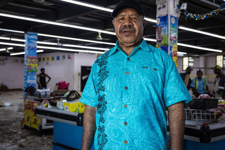 A man in an island shirt.