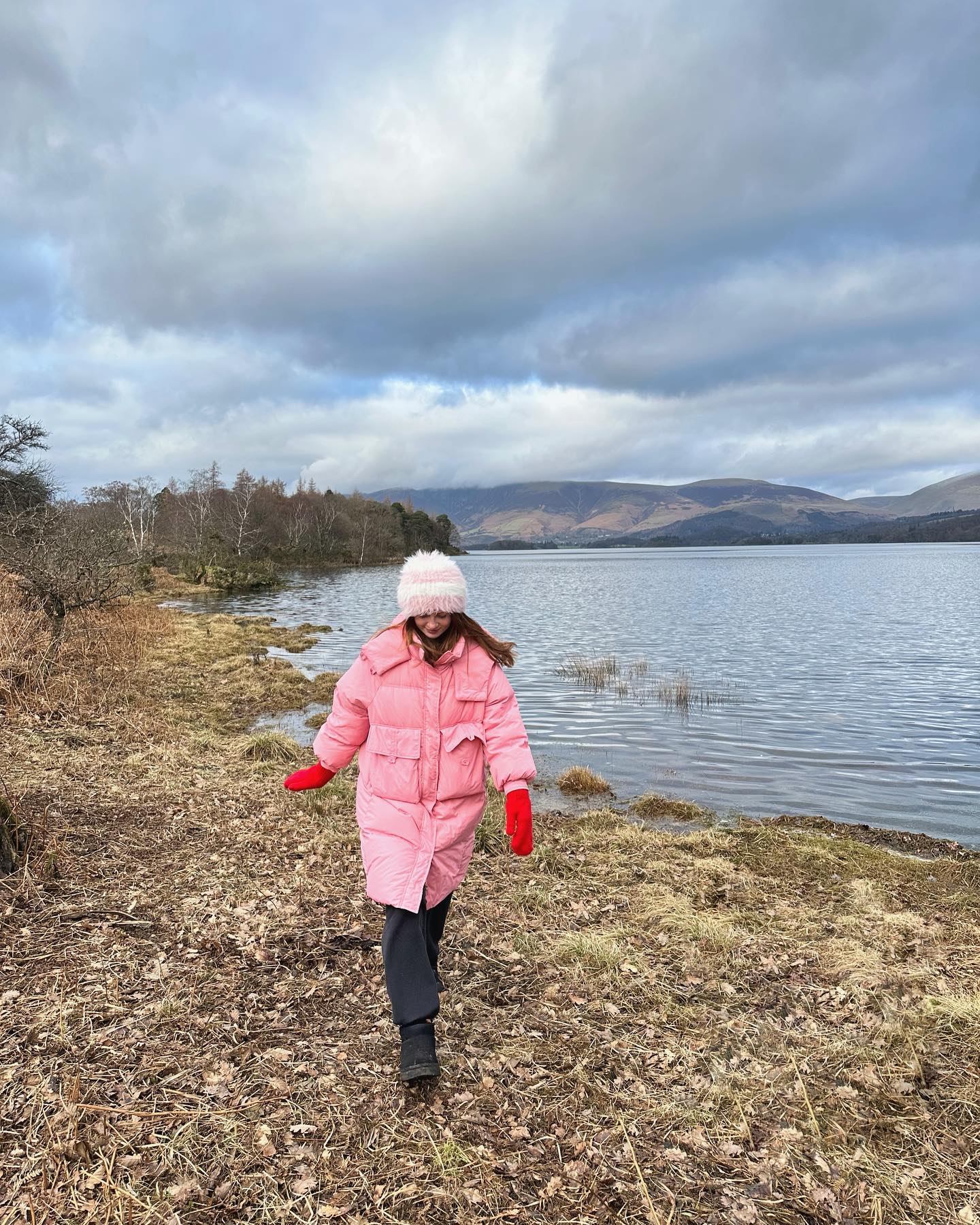 The actress, 22, wrapped up in a pink coat for their rural getaway