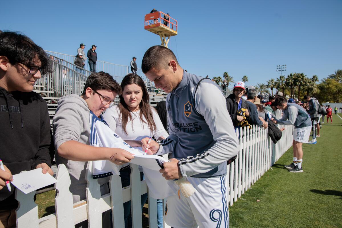 Galaxy forward Dejan Joveljic signs autographs before a preseason match against the New York Red Bulls.