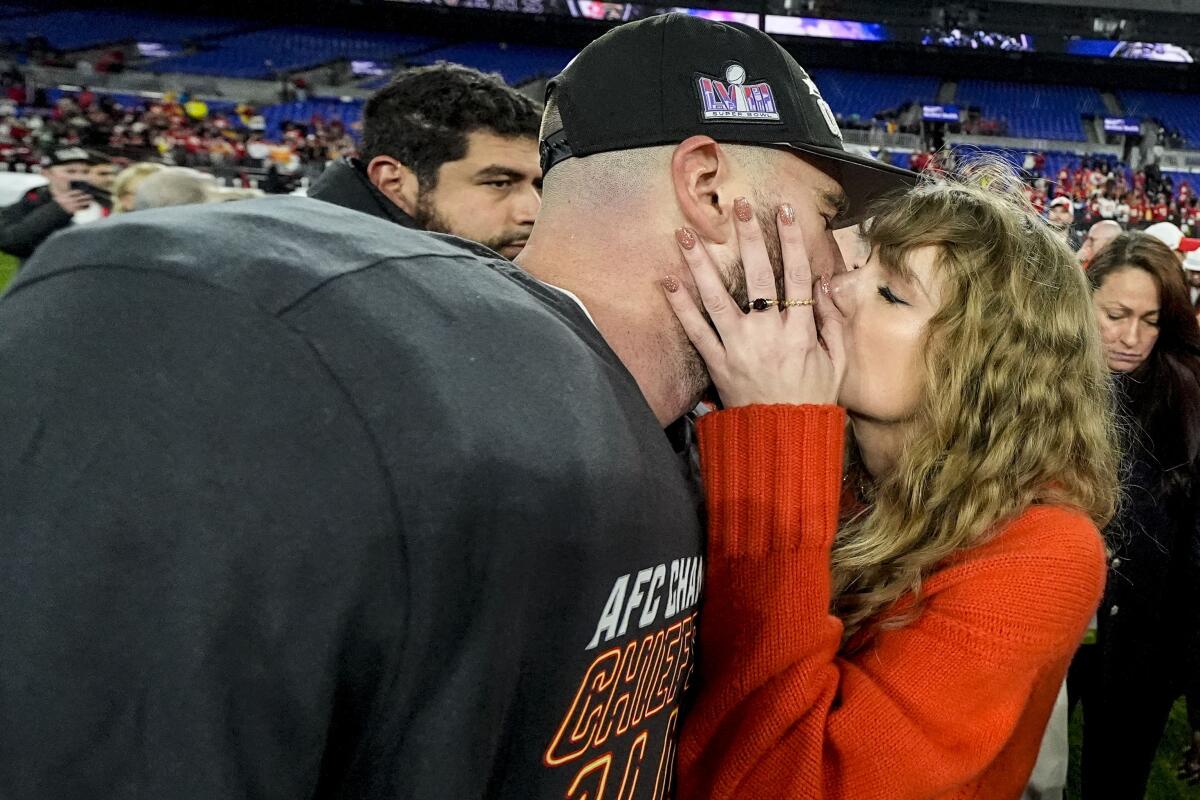 A man and woman kiss