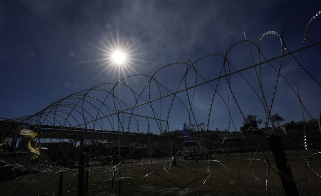 Concertina wire is stretched through Shelby Park in Eagle Pass, Texas.