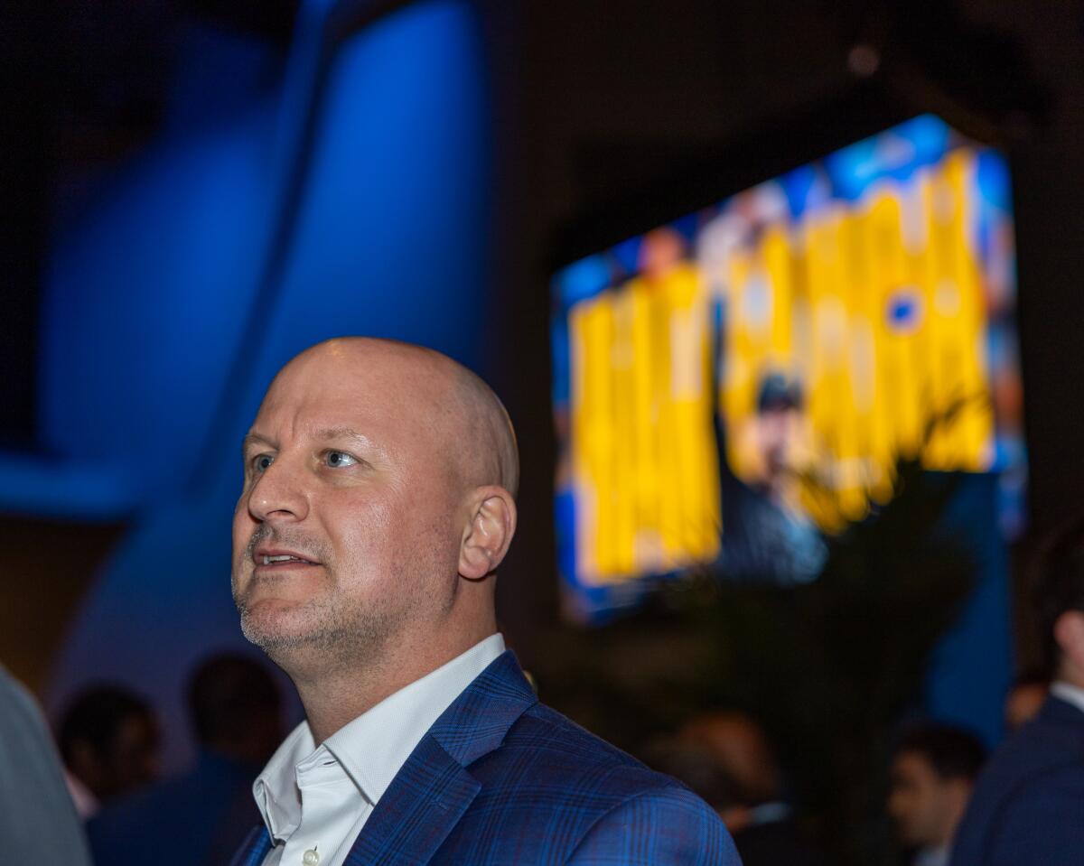 Chargers new general manager Joe Hortiz watched from the audience when Jim Harbaugh was introduced as head coach.