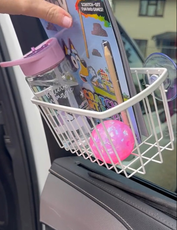 She has filled the basket with her kids' favourite toys and snacks to keep them busy