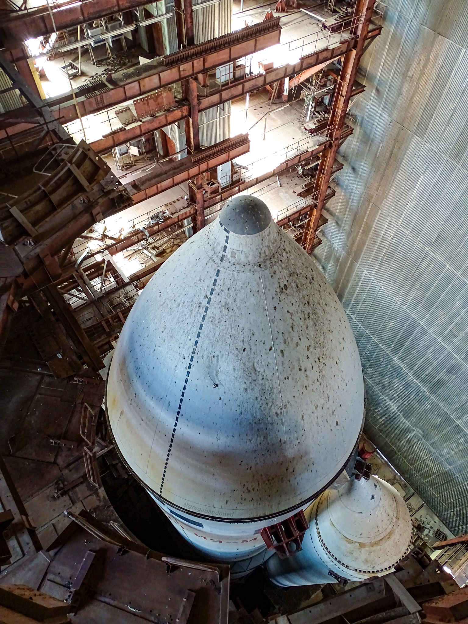 A top view shows the nose cone of the rocket covered in bird poop.