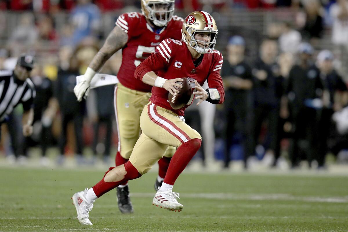 San Francisco 49ers quarterback Brock Purdy (13) runs during the NFC championship game against the Detroit Lions.