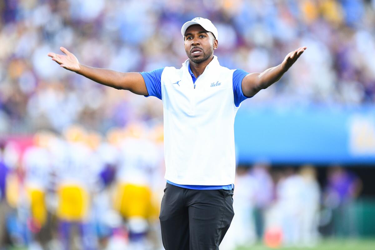 UCLA athletic director Martin Jarmond gestures during a game.