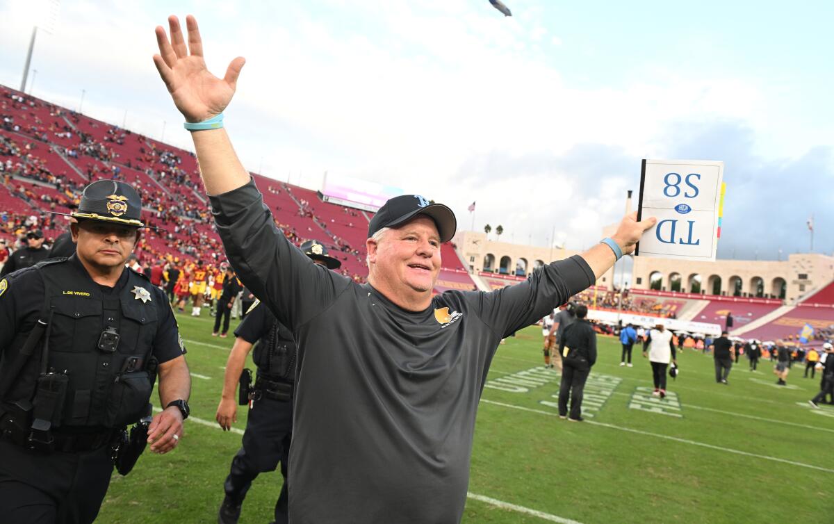 Chip Kelly celebrates UCLA's win over USC at the Coliseum on Nov. 18.