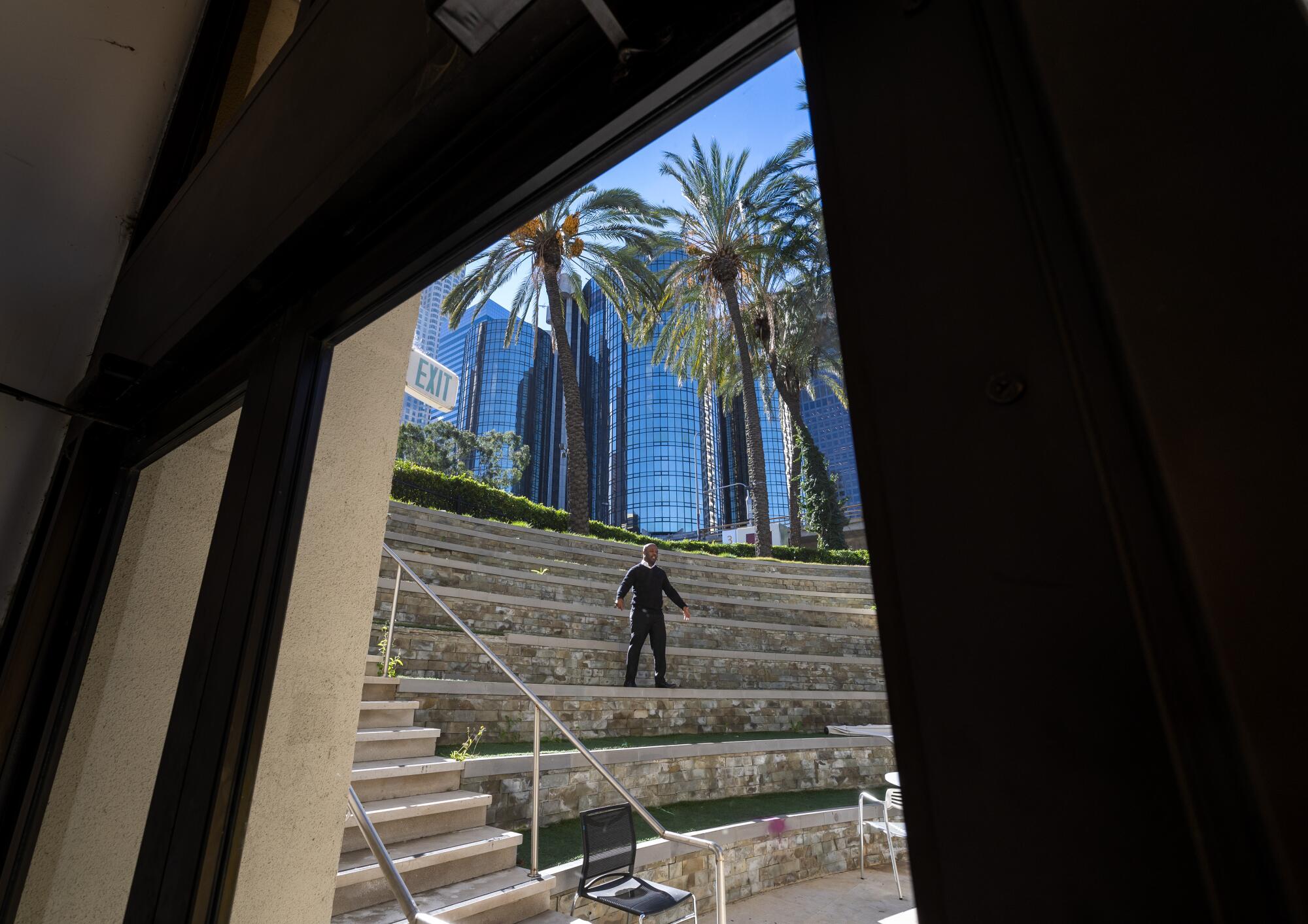 Academy of Media Arts school principal Dana Hammond stands in the school's outdoor amphitheater.