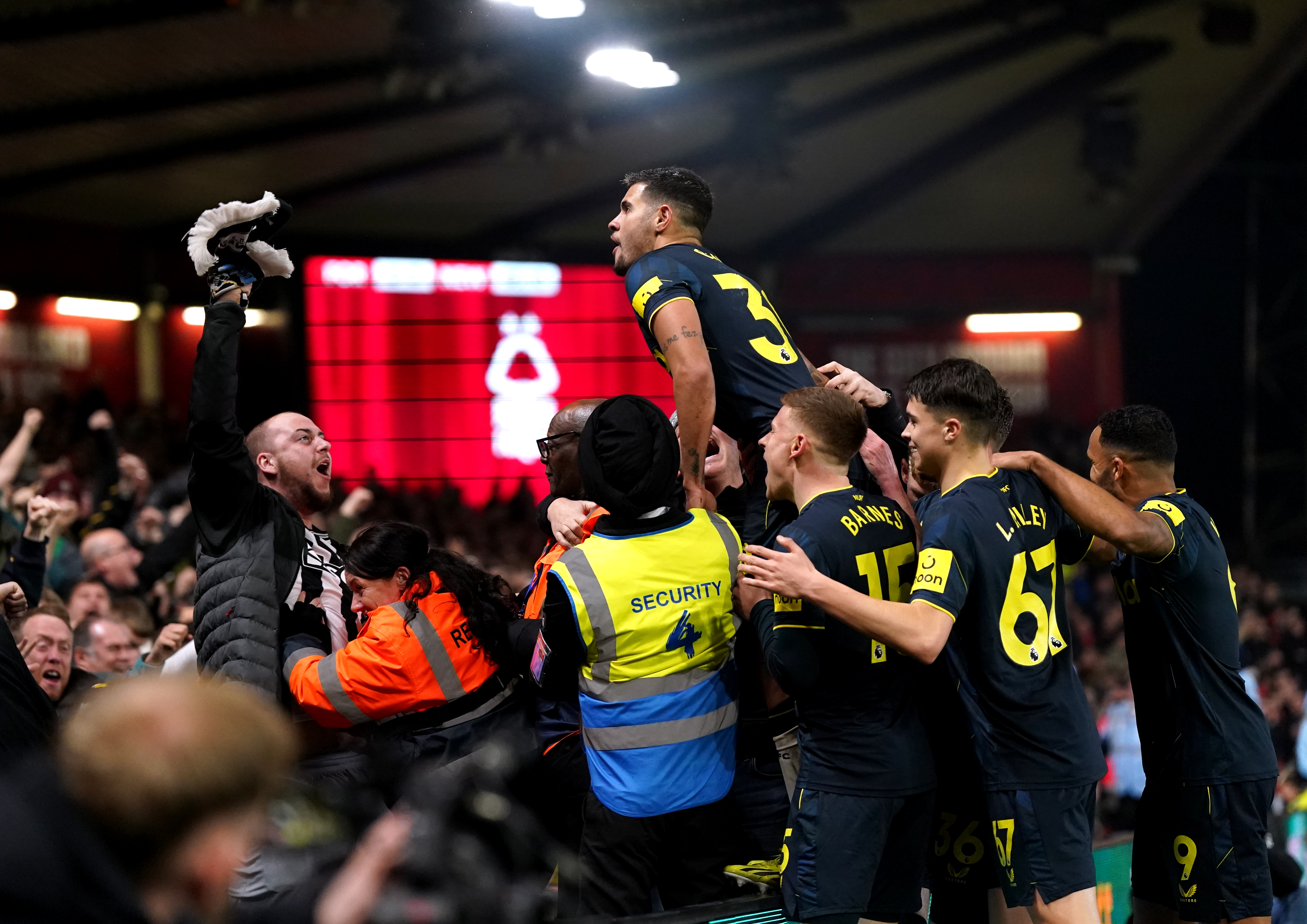 Guimaraes celebrates with fans after netting Newcastle's winner