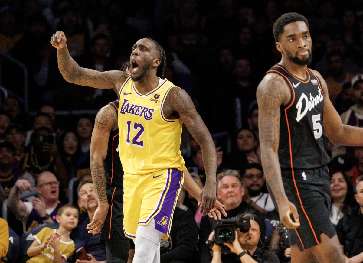 Lakers forward Taurean Prince reacts after being fouled while driving to the basket.