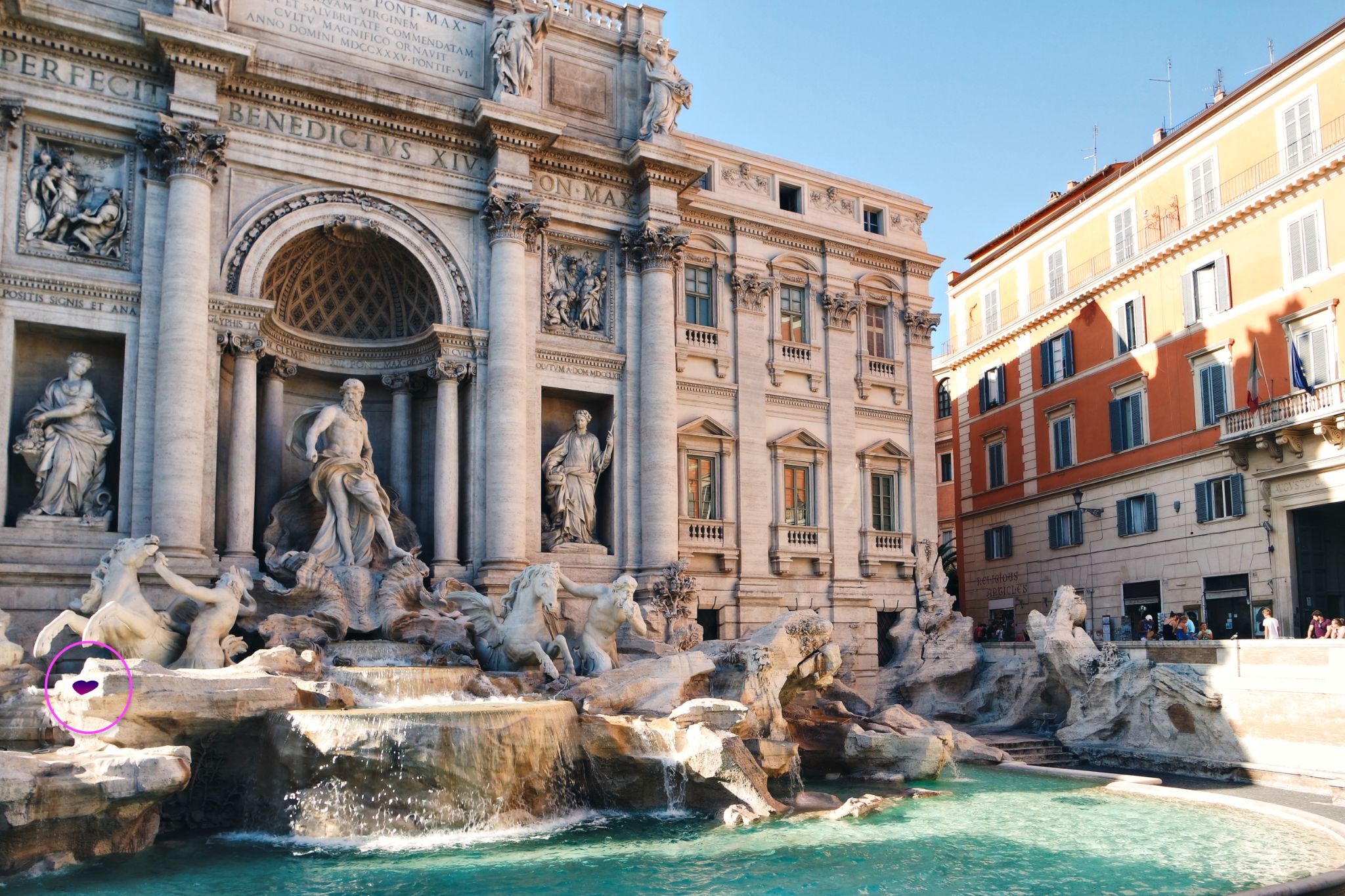 It’s there! It stands out quite well on the white stone, but with all the intricate details of the fountain it’s deceptively hard to find