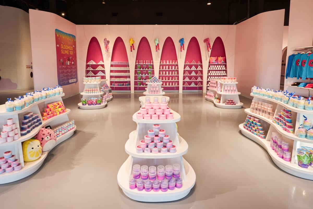 Stacks of slime containers in a gift shop. 