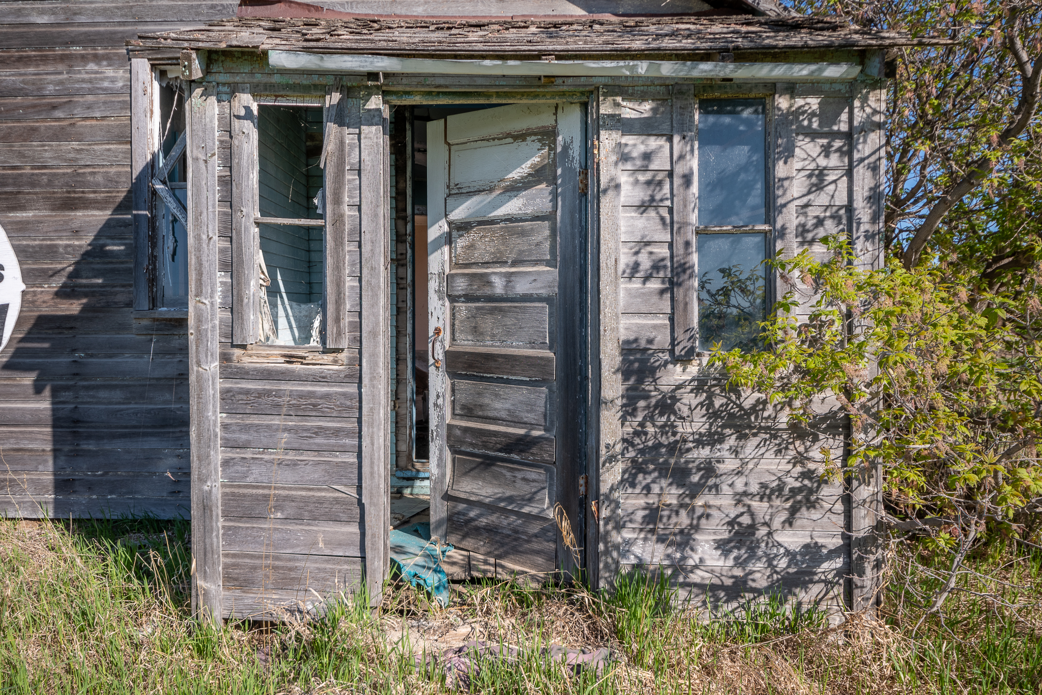 The building door in the abandoned town left with its door open