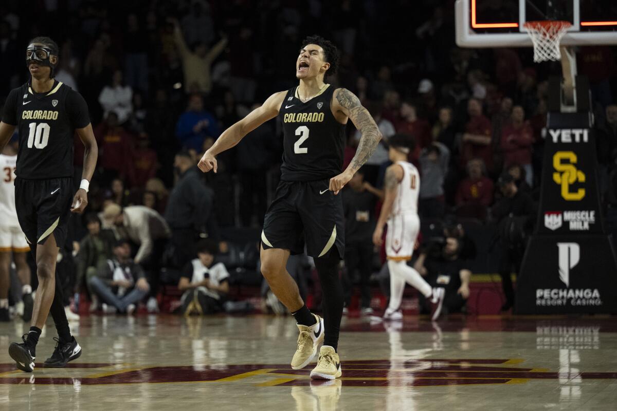 Colorado guard KJ Simpson celebrates after the Buffaloes' double-overtime win over USC.