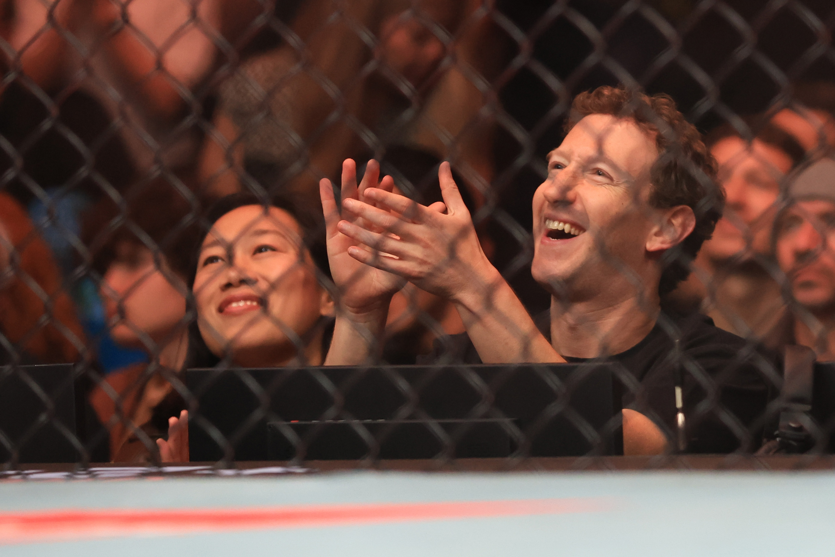 He was joined cageside by wife Priscilla Chan