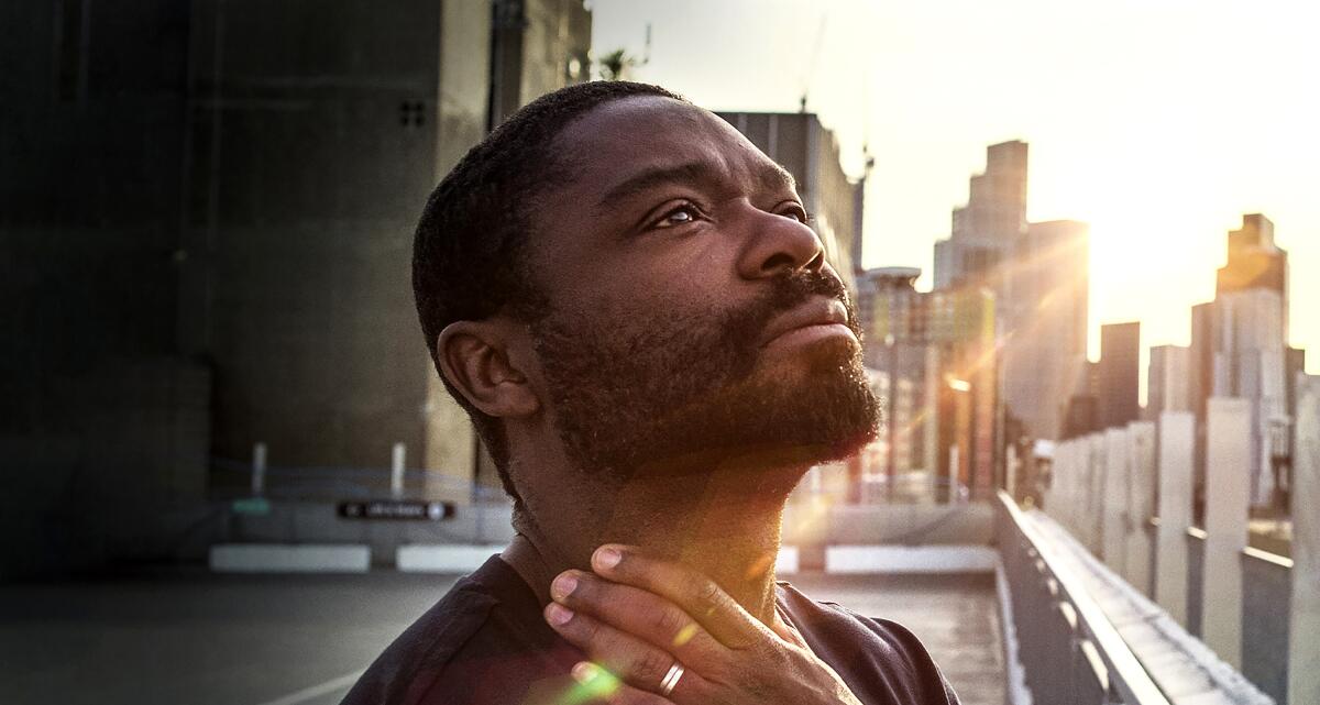 A man stands on a rooftop looking out at the big city surrounding him in "The After." 