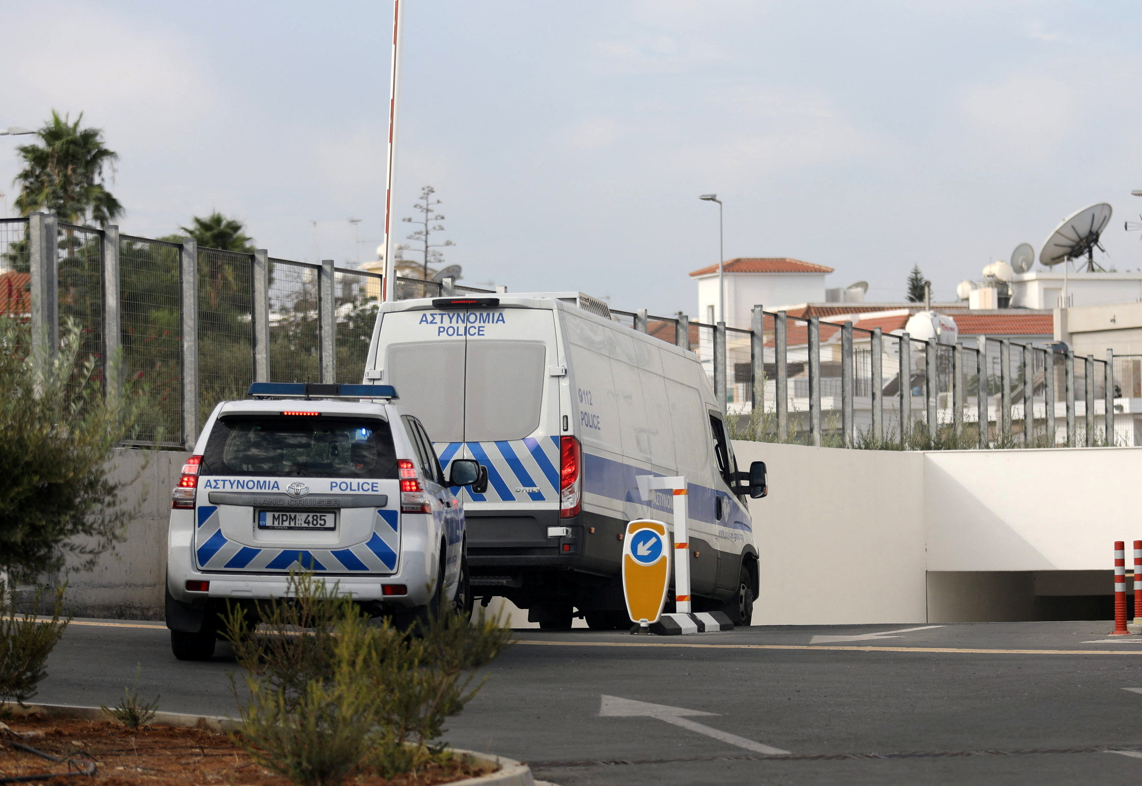 A police van carrying the five suspects arrives at the courthouse in October 2023