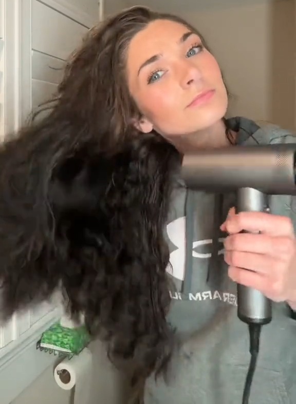 After adding treatments, she pre-blow dried her hair