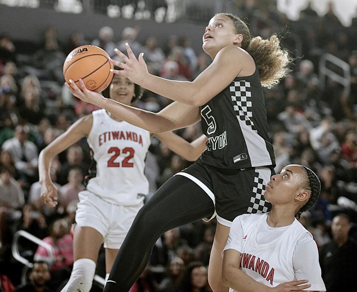 Sierra Canyon's Jerzy Robinson goes up for a shot against Etiwanda on Friday.