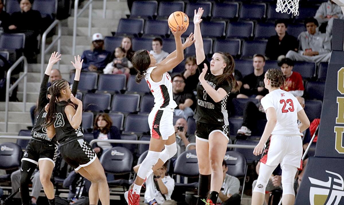 Etiwanda’s Mykelle Richards shoots over Sierra Canyon’s Emilia Krstevski.