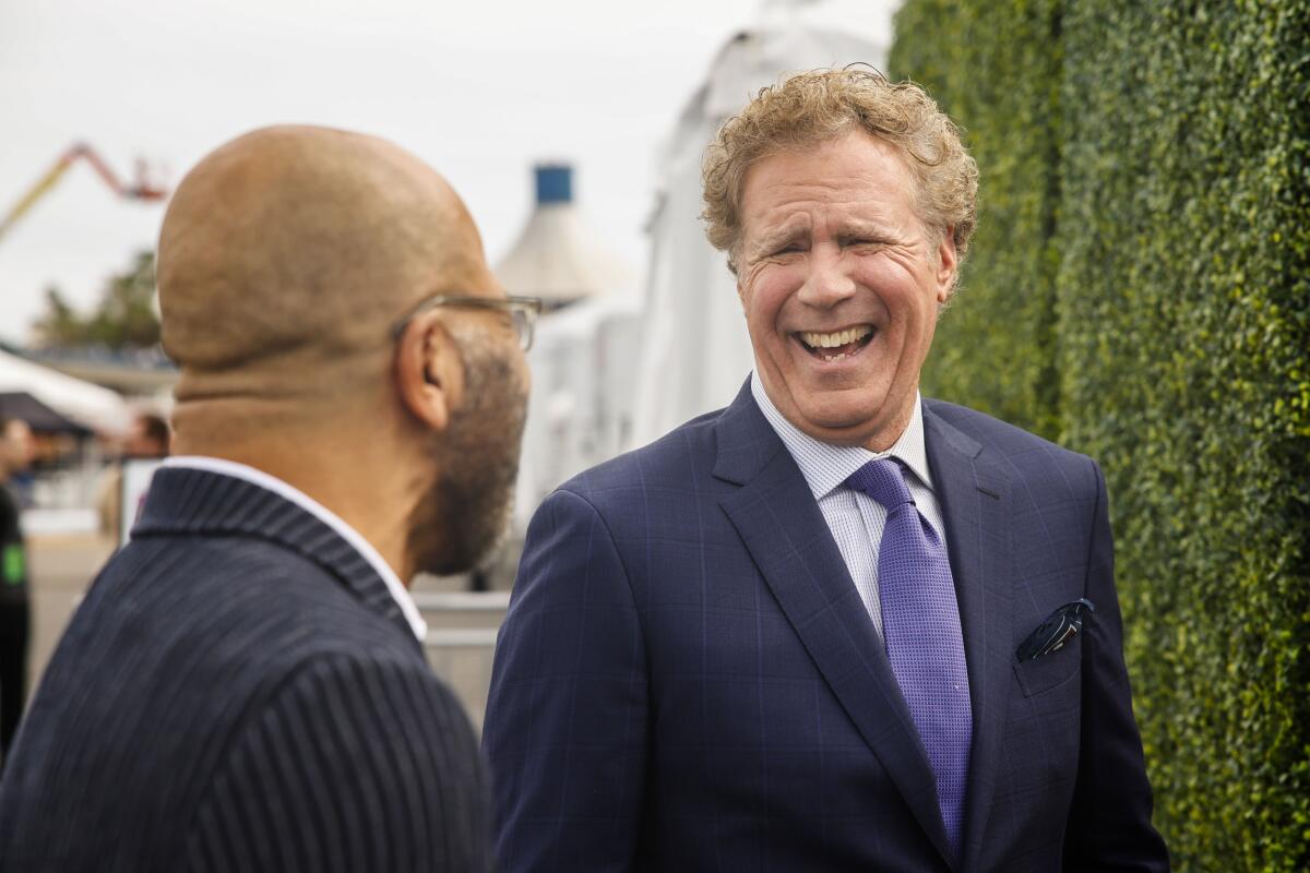 An actor laughs at an awards show.