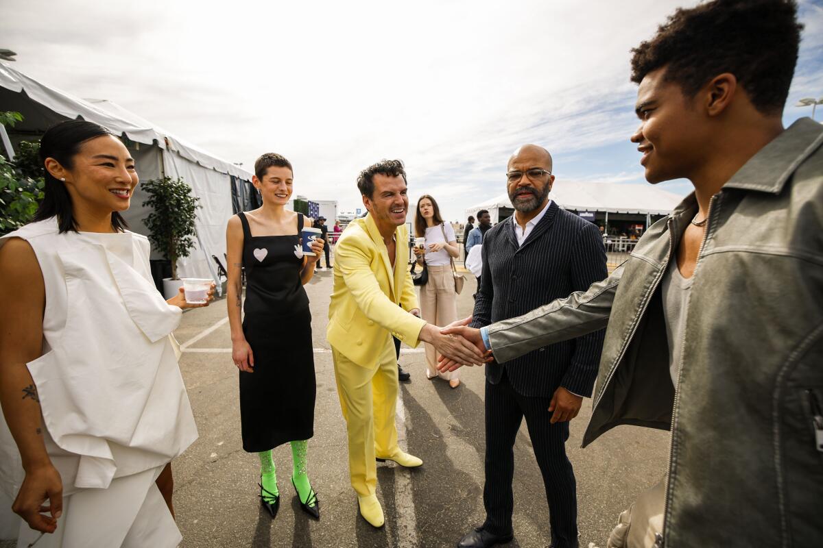 Actors greet at an awards show.