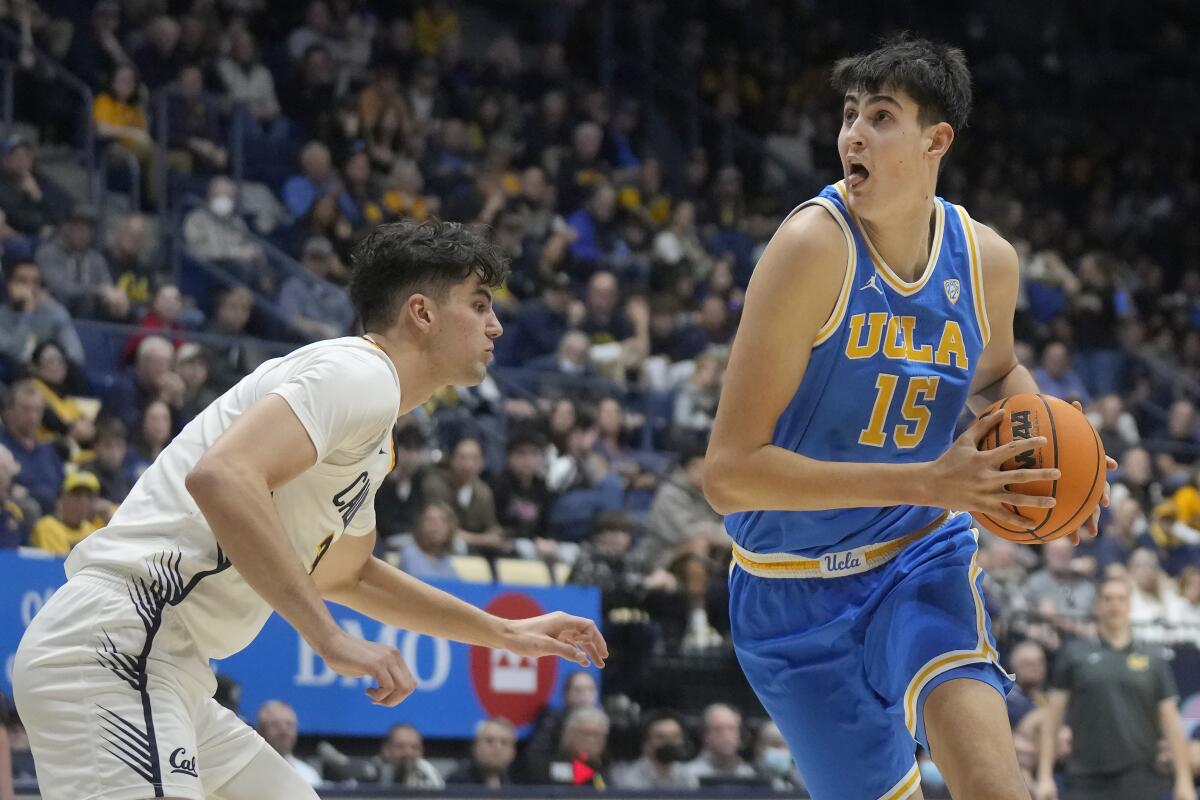 UCLA center Aday Mara drives to the basket against California guard Gus Larson 