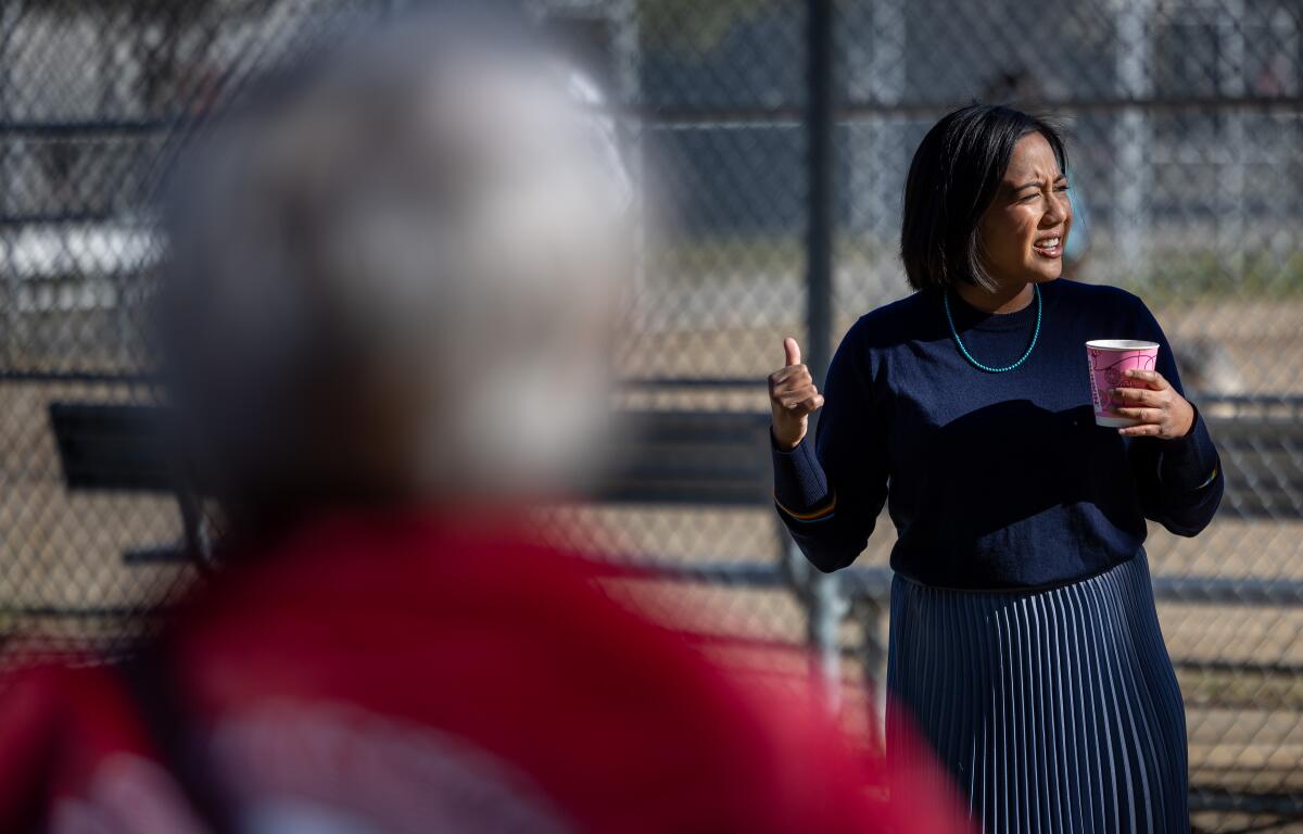 Attorney Ysabel Jurado, who is running to unseat De León, talks with volunteers at a canvassing event in January. 