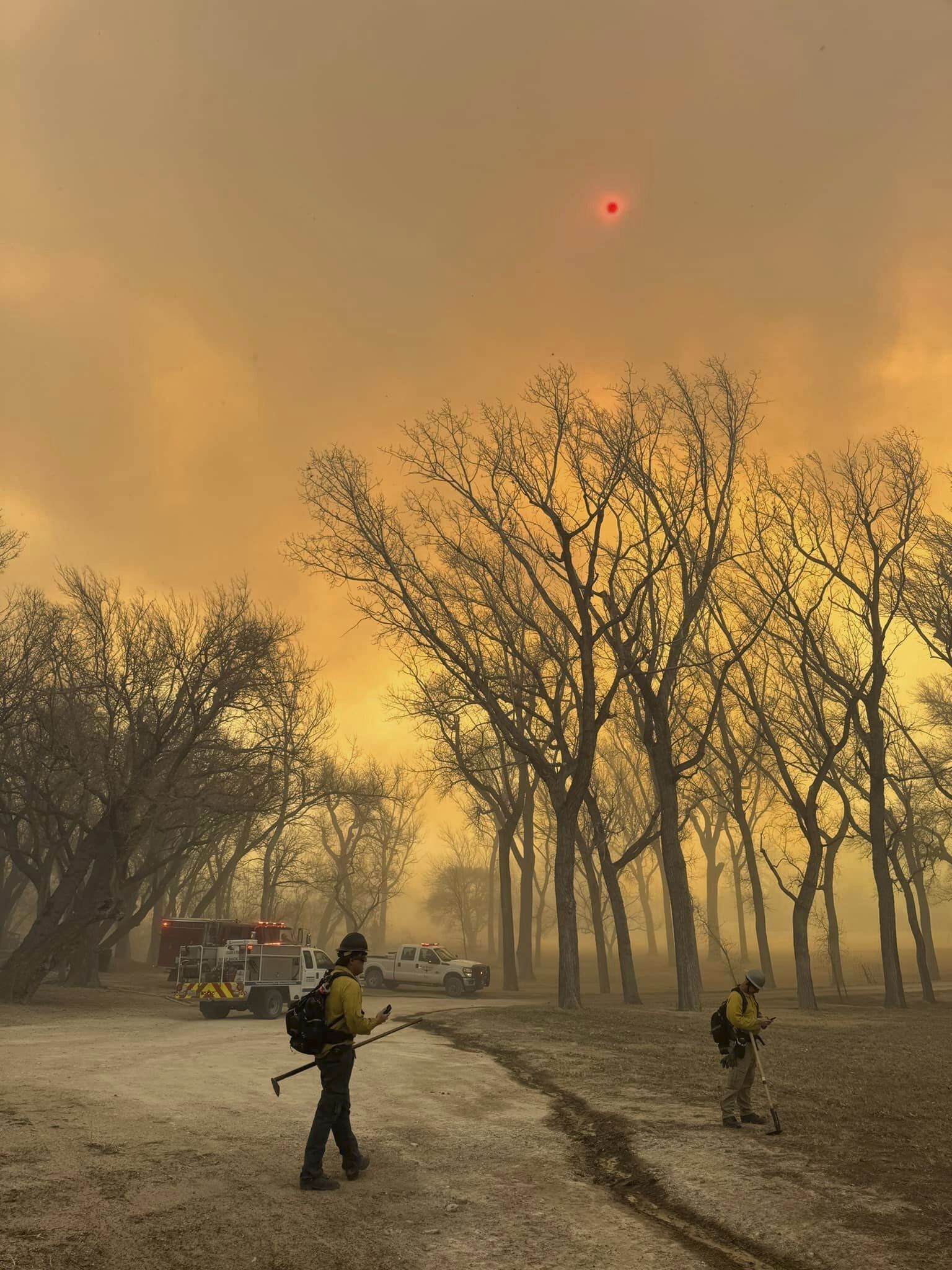 Eerie pictures show an orange sky and red blazing sun as the wildfires in Texas rage