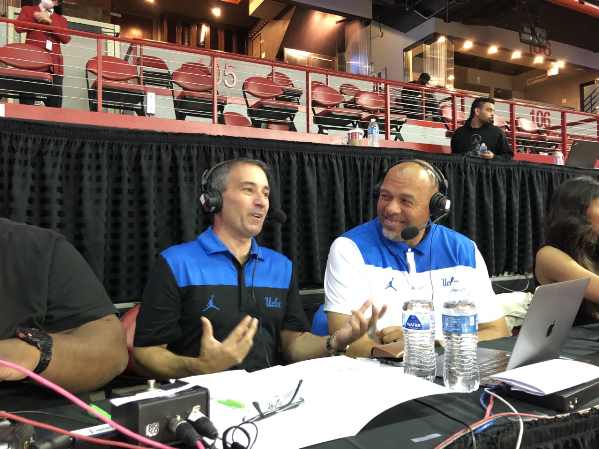 Broadcast partners Josh Lewin and Tracy Murray preparing to call a UCLA game