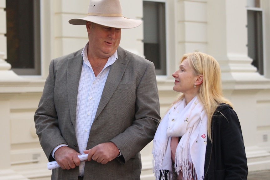 Independent MPs Lara Alexander and John Tucker looking at each other.