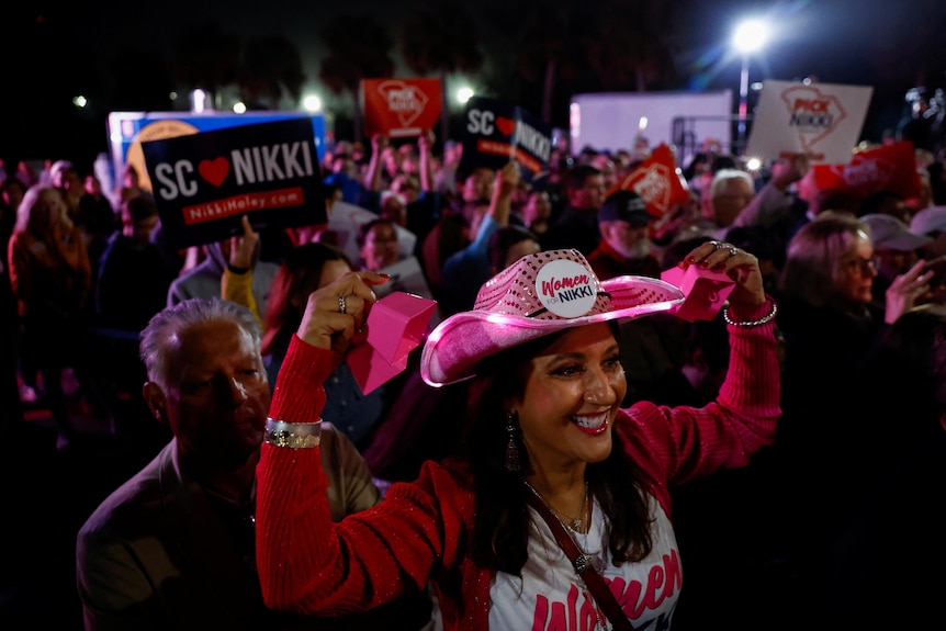 Nikki Haley supporters with signs at a Haley event