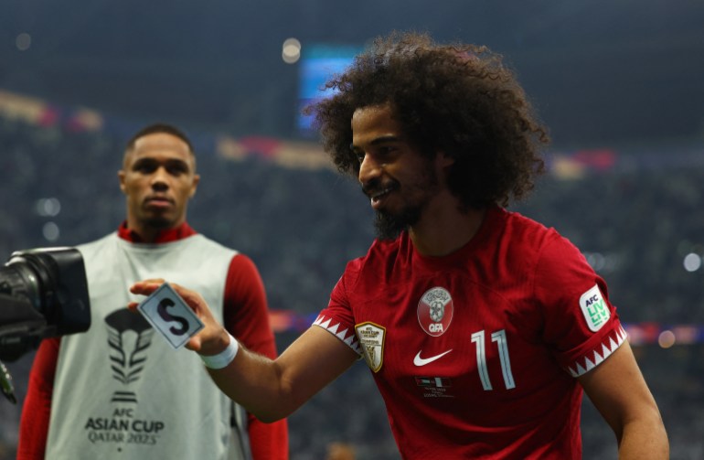 Soccer Football - AFC Asian Cup - Final - Jordan v Qatar - Lusail Stadium, Lusail, Qatar - February 10, 2024 Qatar's Akram Afif celebrates scoring their second goal REUTERS/Molly Darlington