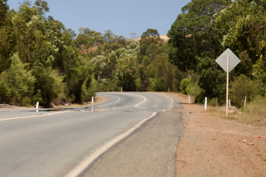 Mirages appear on a road amid a heatwave