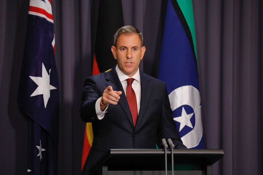 Treasurer Jim Chalmers pointing as he is questioned in the Blue Room for a press conference