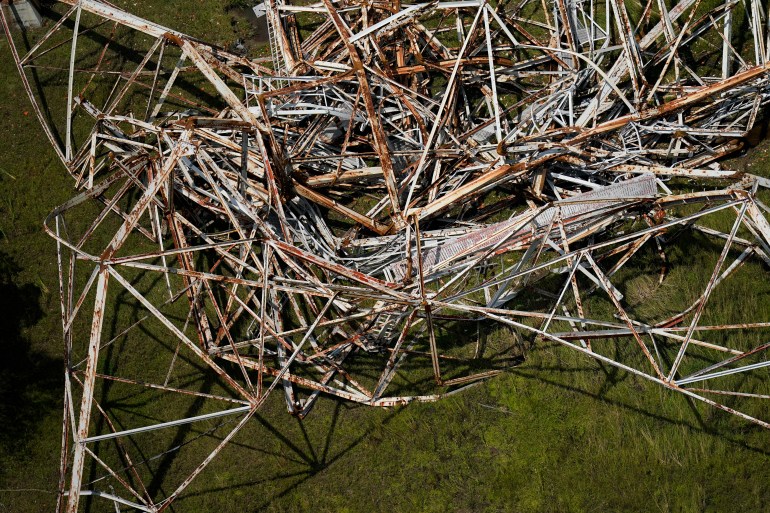 A twisted tower that carried crucial electrical feeder lines to the New Orleans metro area lies collapsed in the aftermath of Hurricane Ida in Bridge City, Louisiana