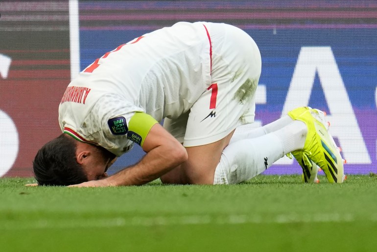 Iran's Alireza Jahan Bakhsh celebrates after winning the match