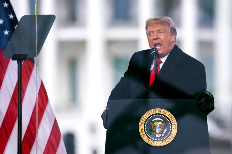 Donald Trump speaks behind a White House podium next to a US flag.