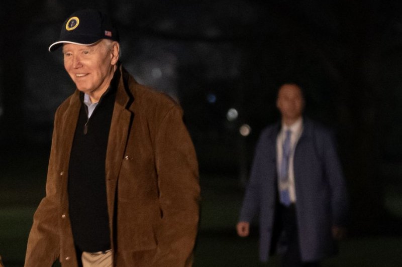 President Joe Biden walks on the South Lawn of the White House on Sunday after arriving on Marine One in Washington, D.C., and hours after the Biden campaign posted its first video of the president on TikTok during Sunday's Super Bowl despite national security concerns over the app. Photo by Nathan Howard/UPI