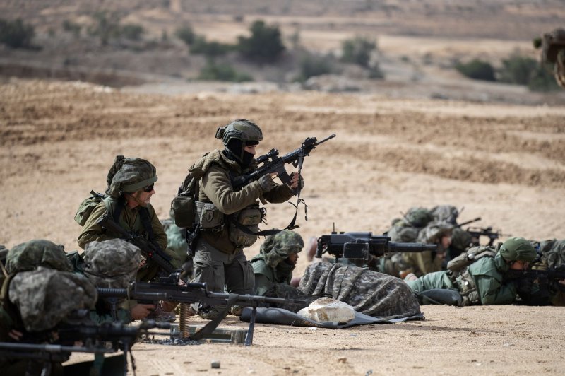 Israeli infantry soldiers train with light weapons outside the Tze'elim base in southern Israel near the Gaza Strip on November 20, 2023. A new U.S. security memorandum attaches requirements for countries receiving military to certify their compliance with international law. File Photo by Jim Hollander/UPI