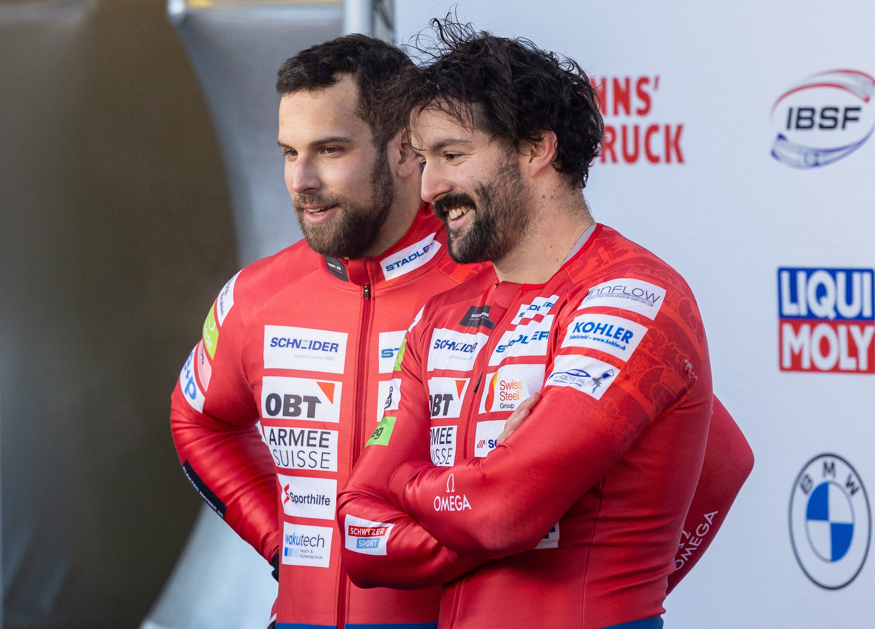 Sandro Michel, left, was rushed to hospital by helicopter after a crash during bobsleigh World Cup training