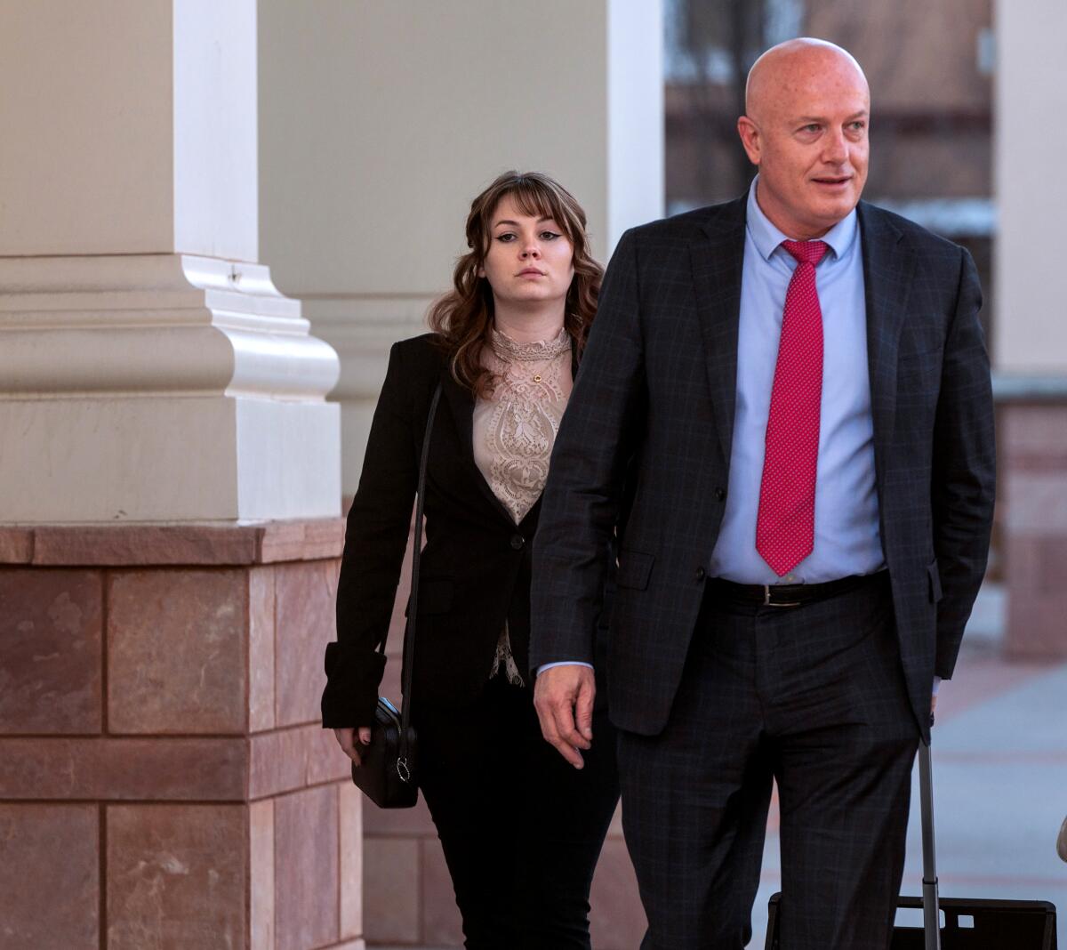 Hannah Gutierrez, left, with her attorney Jason Bowles.