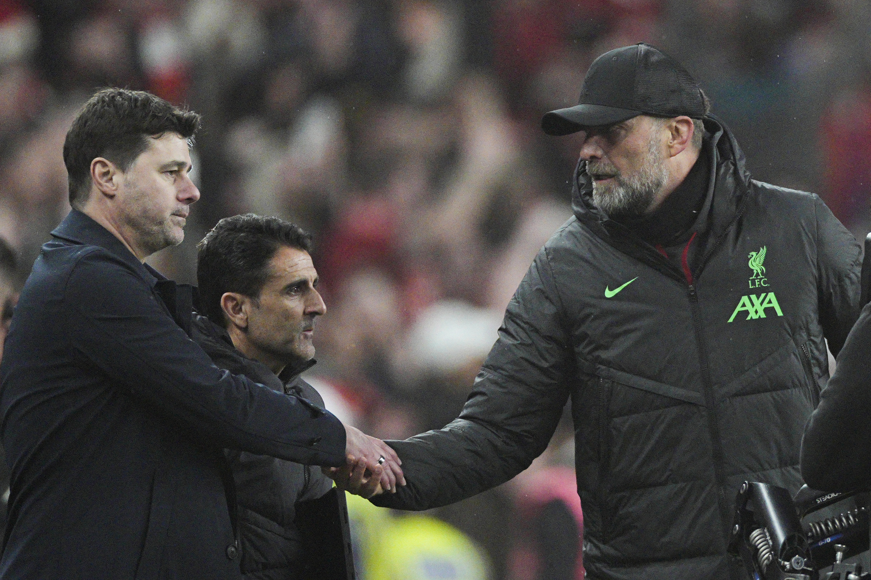 Pochettino looks stunned after defeat as he shakes Klopp's hand